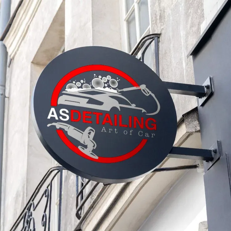 The AS Detailing badge on a round hanging sign on a building facade